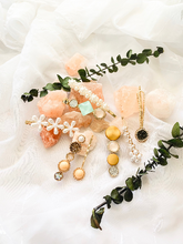 Load image into Gallery viewer, 2 hair clips yellow and warm rhinestone colors
